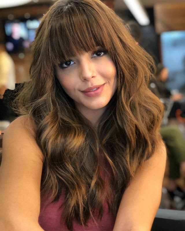 Collarbone Waves with Subtle Highlights Collarbone Waves with Subtle Highlights — Winter Haircuts with Curtain Bangs