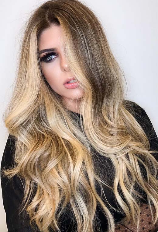 Dark Blonde With Sun-Kissed Highlights Dark Blonde With Sun-Kissed Highlights — Winter Hair Colors for Women Over 40