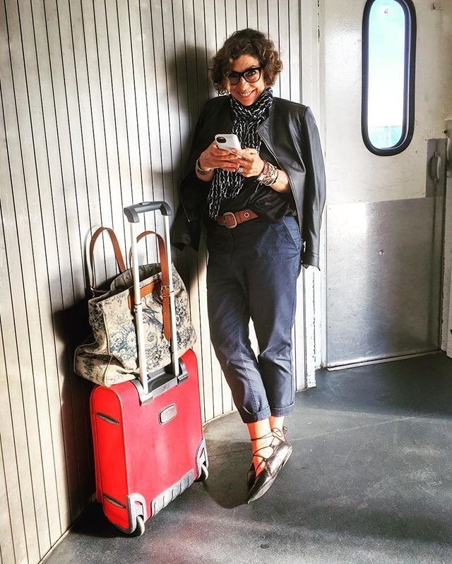 Black Leather Jacket and Cropped Trousers with a Patterned Scarf Accent — Winter Airport Outfits