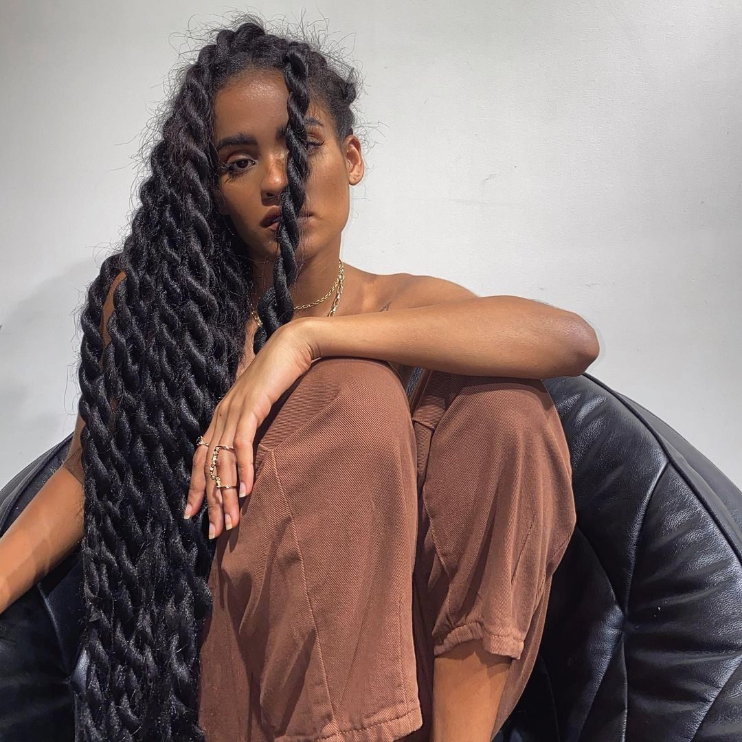Voluminous Wavy Faux Locs Cascading Voluminous Wavy Faux Locs Cascading — Winter Loc Styles