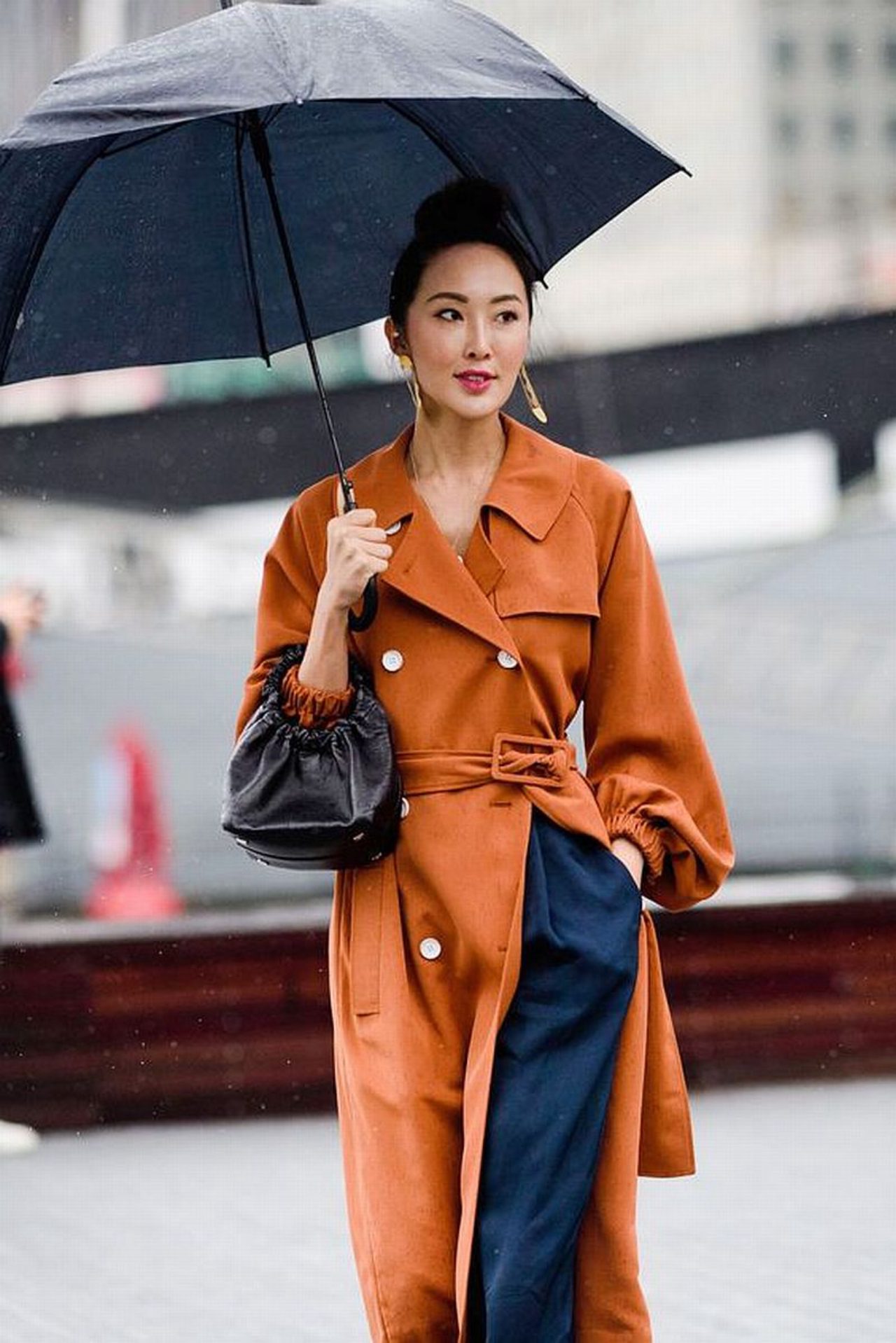 Orange Belted Trench Coat Over Navy Trousers for a Chic Contrast — Colorful Winter Outfits