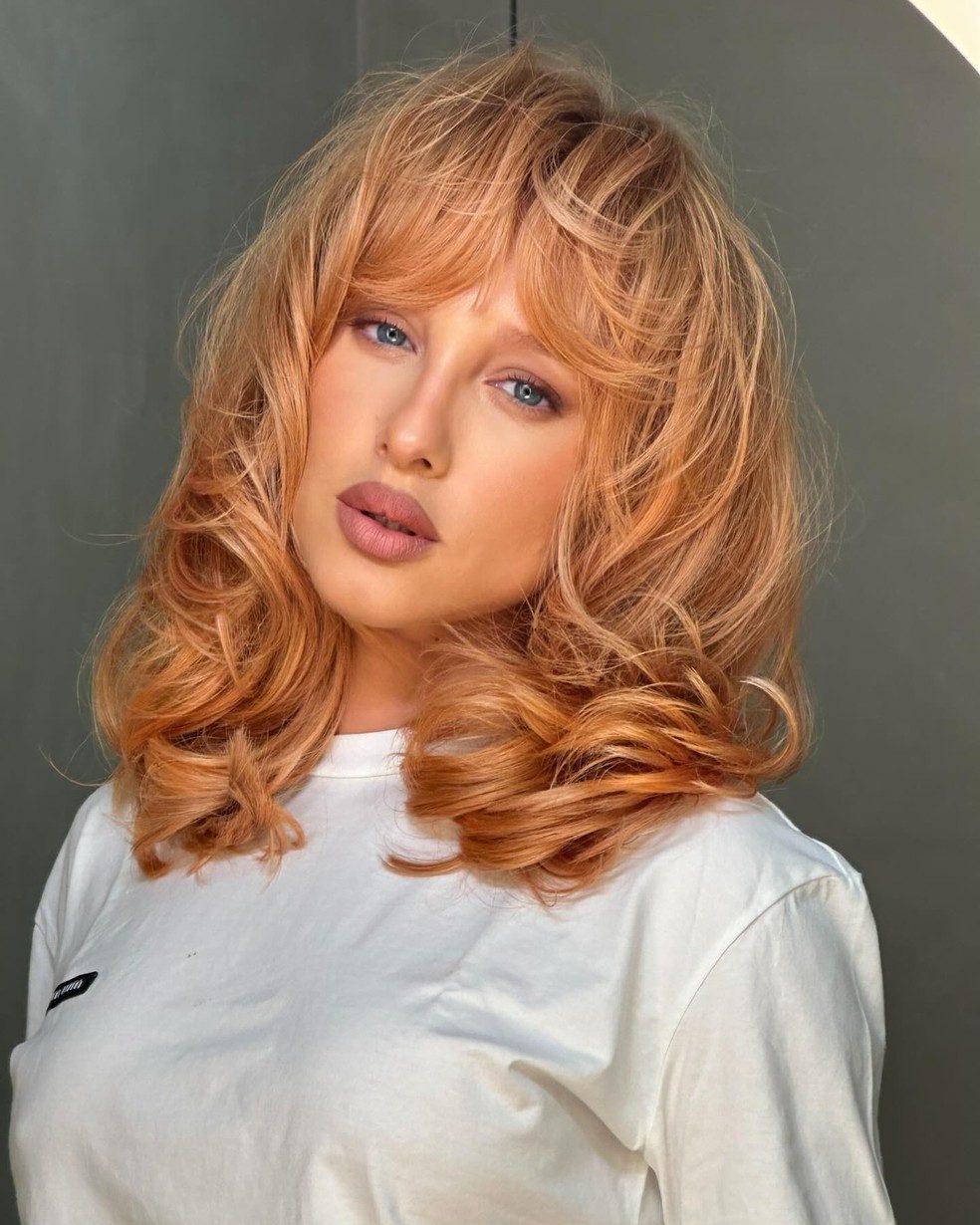 Strawberry Blonde with Blunt Bangs Strawberry Blonde with Blunt Bangs — Winter Hair Colors for Plus Size Women