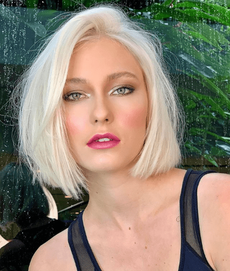 Icy Blonde Bob With Side-Swept Bangs Icy Blonde Bob With Side-Swept Bangs — Winter Hair Colors for Pale Skin