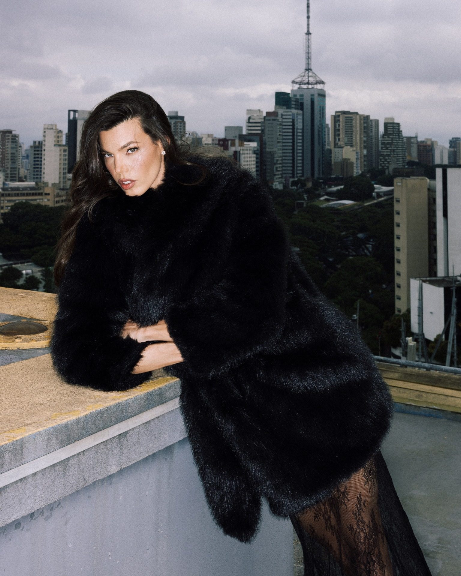 Textural Contrast: Black Coat with Fringed Mini Skirt — Black Coat Outfits