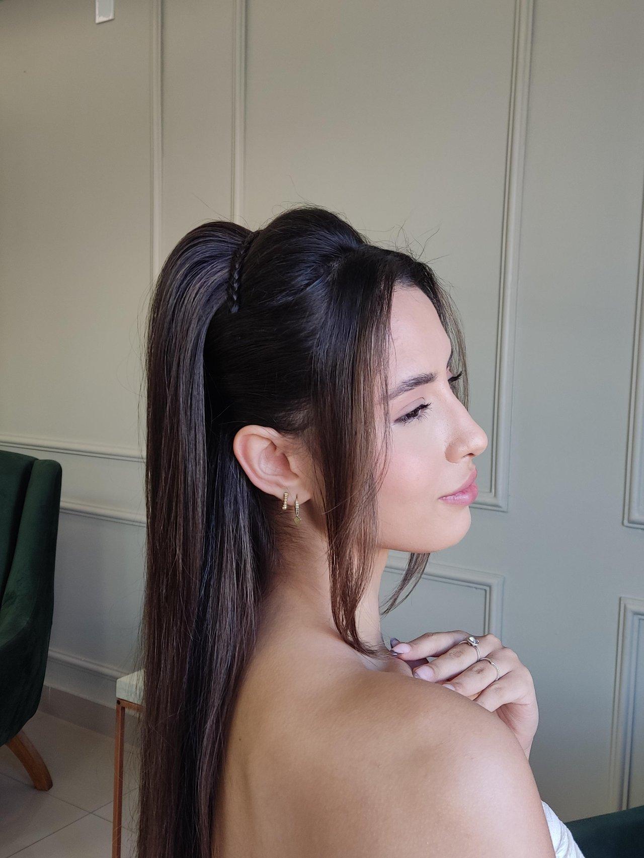 Sleek High Ponytail With Braided Accent — Winter Wedding Guest Hairstyles