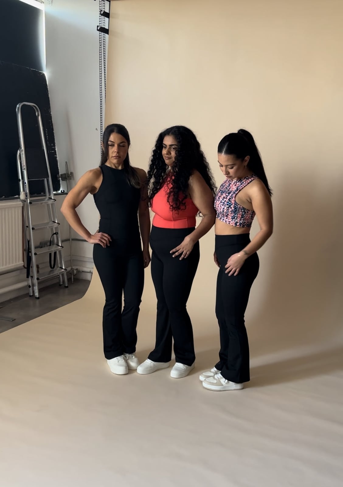 Group Style Black Flare Leggings With Various Tops — Aesthetic Black Flare Leggings Outfit