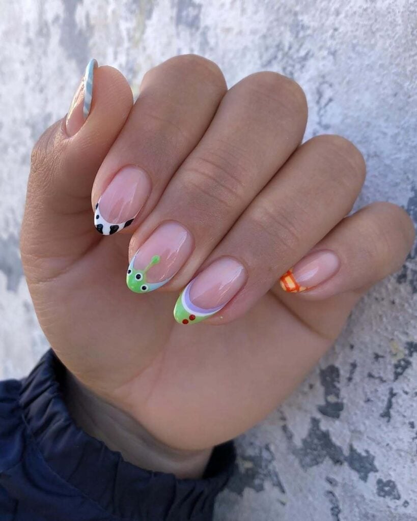 Buzz Lightyear French Tip Nude Almond Nails Buzz Lightyear French Tip Nude Almond Nails — Aesthetic Disney Nails