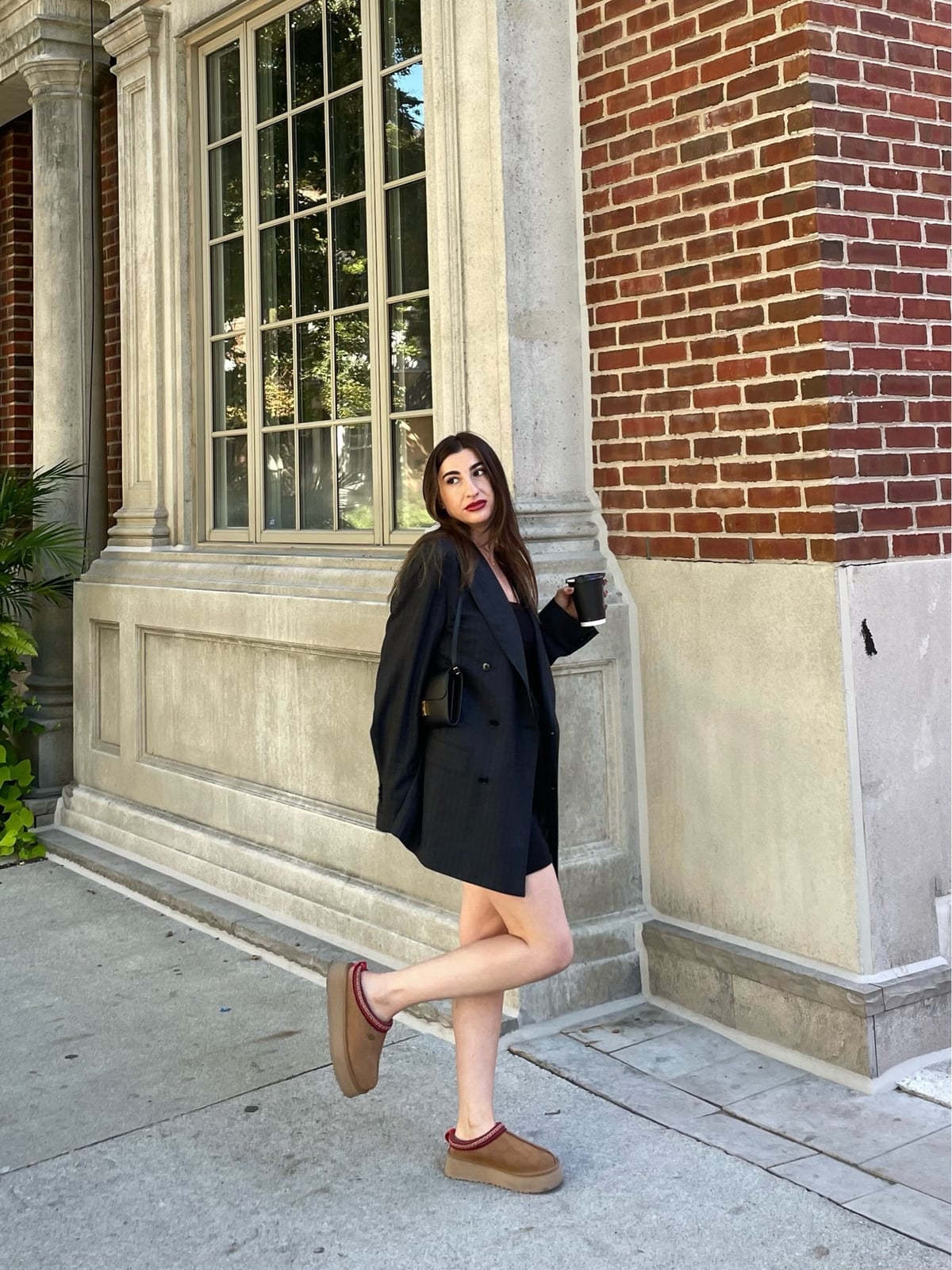 Tan Ugg Tasman Clogs with Red Trim, Black Dress, Close-Up Take — Aesthetic Ugg Tasman Outfit