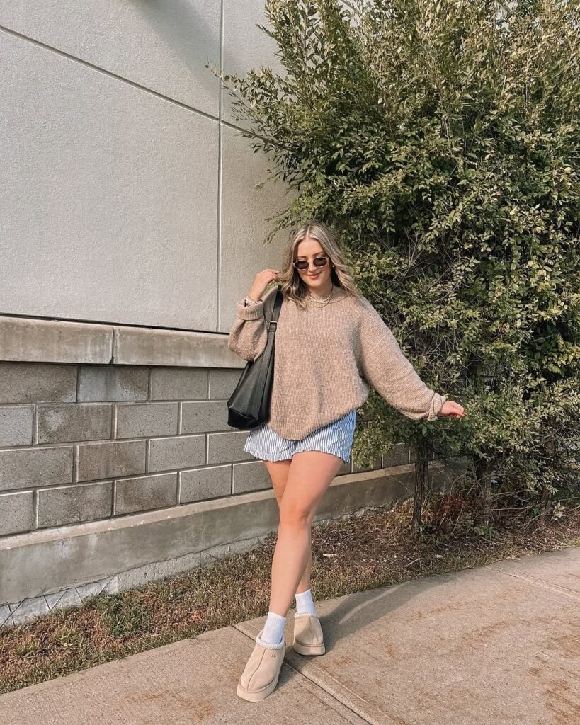 Ugg Slippers with Striped Shorts and Oversized Beige Knit Sweater — Aesthetic Ugg Tasman Outfit