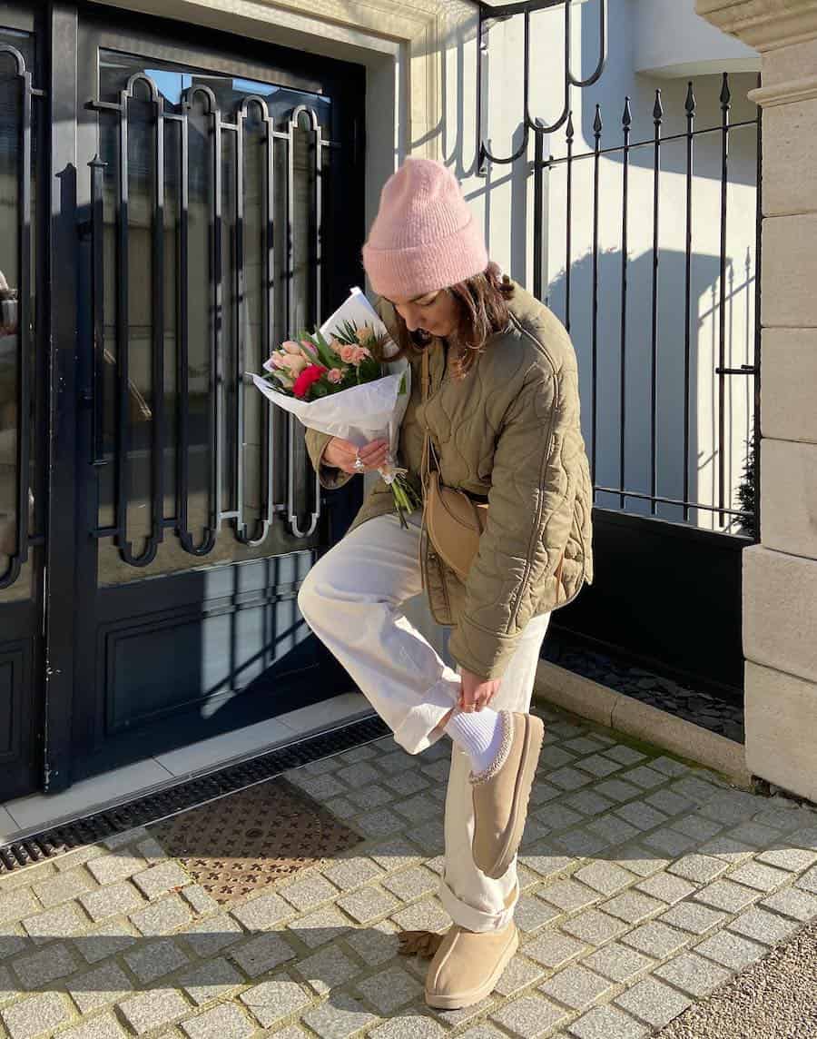 Ugg Slippers with White Wide-Leg Pants and Olive Green Jacket — Aesthetic Ugg Tasman Outfit