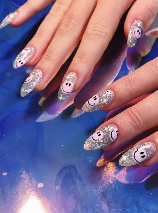 Medium Almond Glitter With Pink Smiley Faces Medium Almond Glitter With Pink Smiley Faces — Aesthetic University Nails