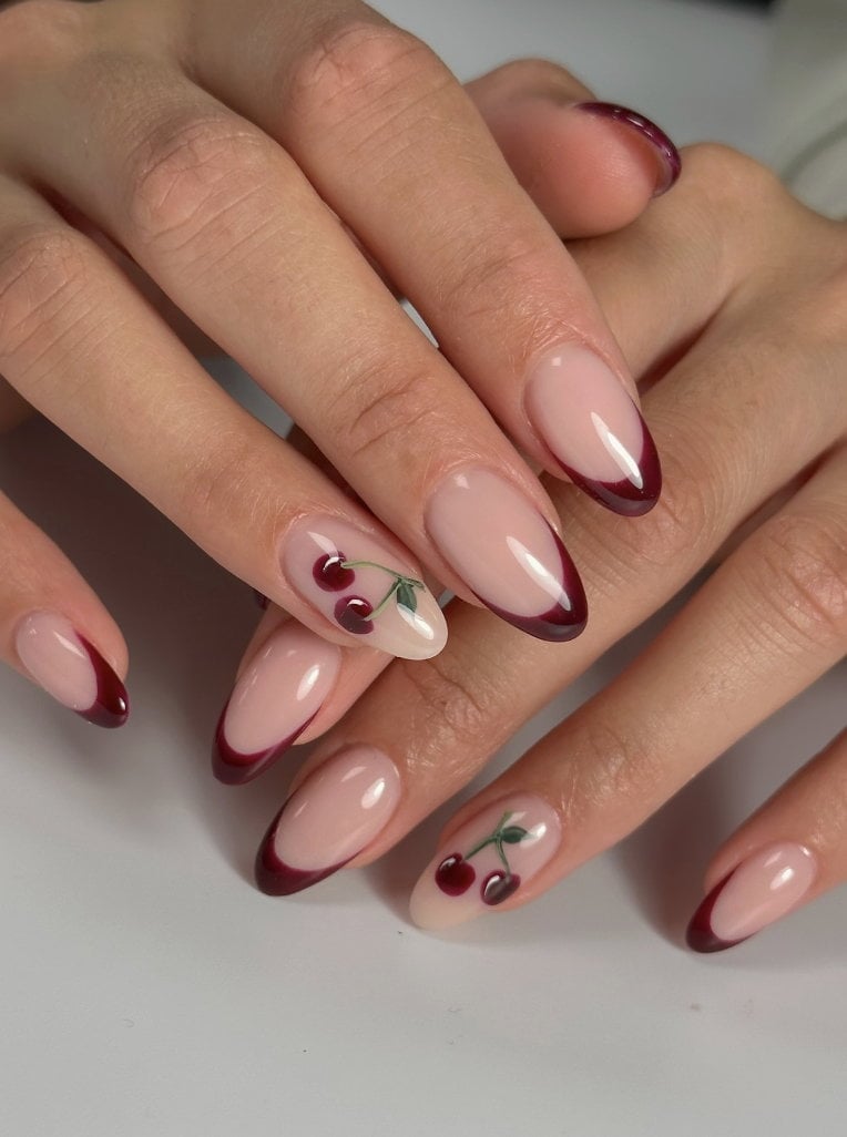 Medium Almond Deep Red French With Cherry Art Medium Almond Deep Red French With Cherry Art — Aesthetic University Nails