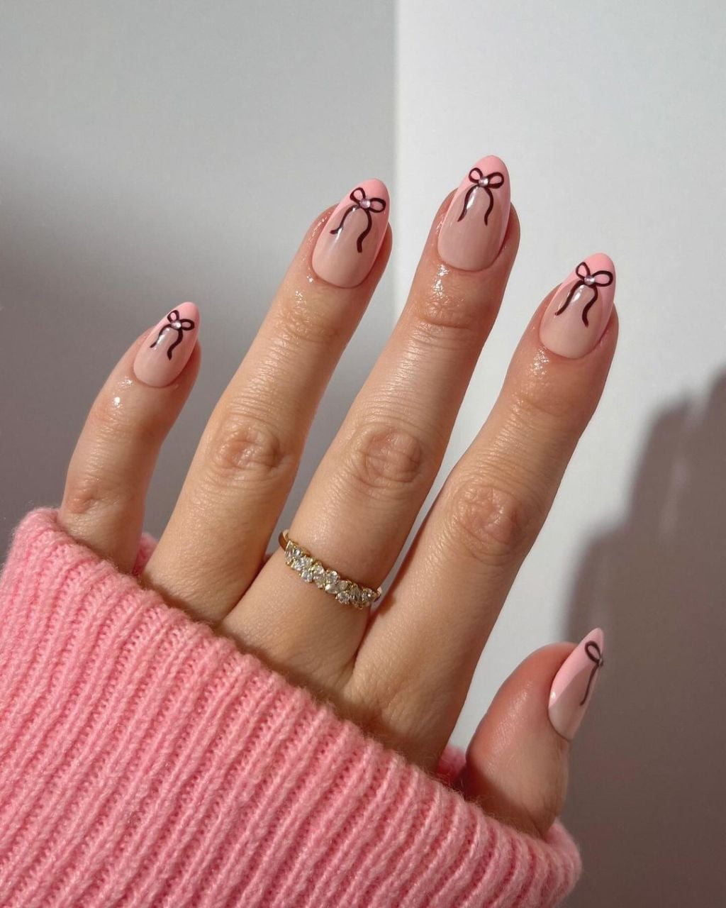 Sheer Pink Medium Almond Nails with Black Bow Outlines Sheer Pink Medium Almond Nails with Black Bow Outlines — Best Classy Nails