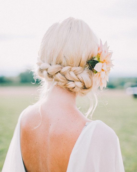 Blonde Braided Updo With Floral Accessory — Best Unique Hairstyles