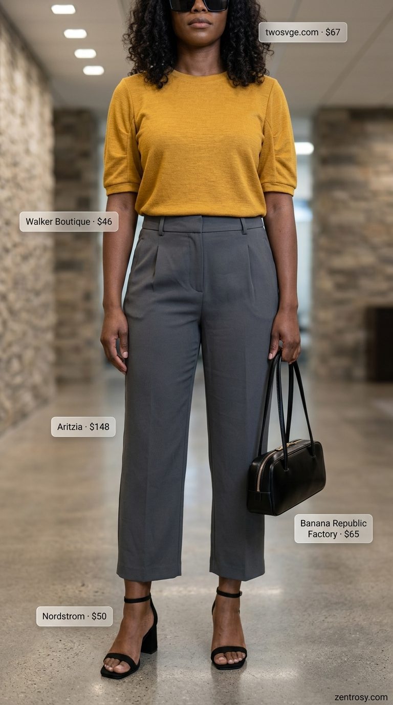 Chic summer business casual outfit for women 2026: Charcoal cropped trousers, mustard sweater, black sandals for modern office style.