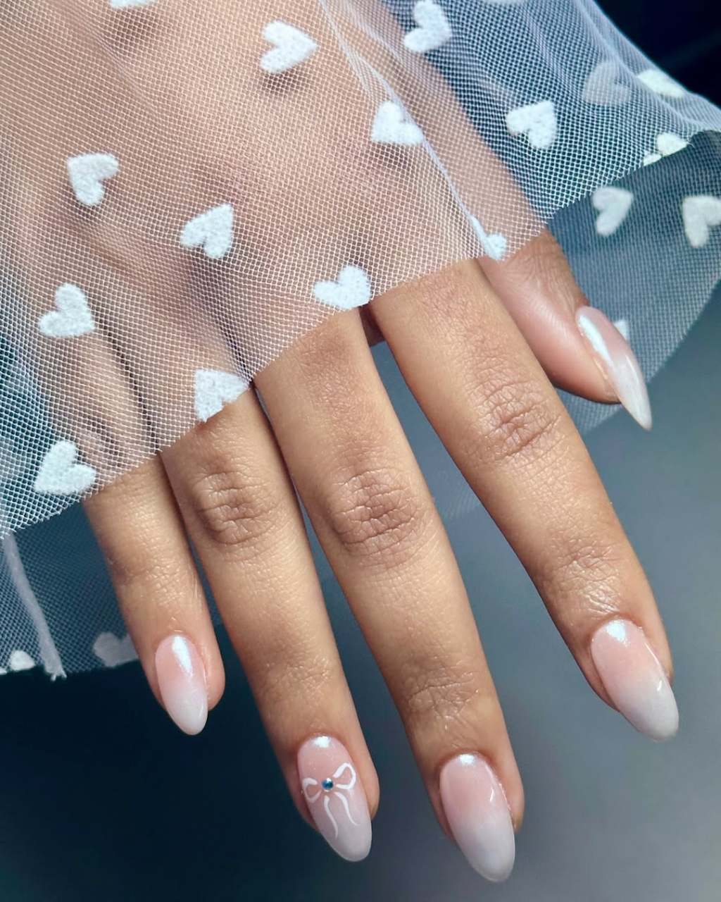 Pearlescent Ombre Bow Accent Oval Nails Pearlescent Ombre Bow Accent Oval Nails — Classy Anniversary Nails