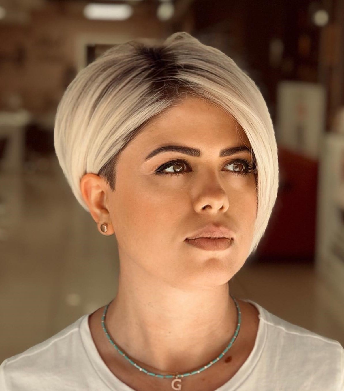 Sleek Platinum Pixie With Dark Roots Sleek Platinum Pixie With Dark Roots — Classy Asymmetrical Pixie