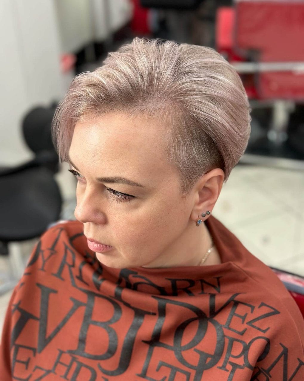 Slicked Back Ash Blonde Pixie With Side Shave Slicked Back Ash Blonde Pixie With Side Shave — Classy Asymmetrical Pixie