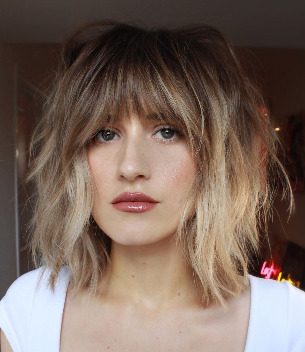 Collarbone Shag With Choppy Bangs Collarbone Shag With Choppy Bangs — Classy Bangs for Round Face
