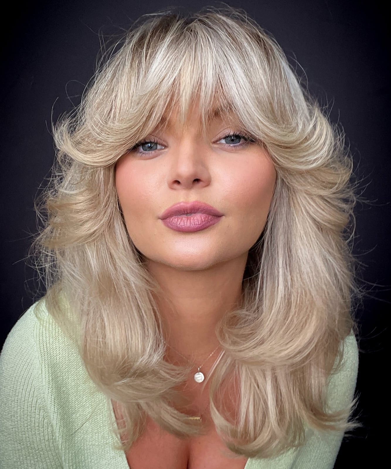 Collarbone Blowout With Voluminous Curtain Bangs Collarbone Blowout With Voluminous Curtain Bangs — Classy Bangs for Round Face