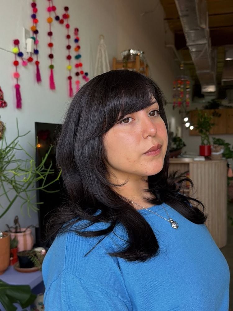 Mid-Back Layers With Side-Swept Bangs Mid-Back Layers With Side-Swept Bangs — Classy Bangs for Round Face