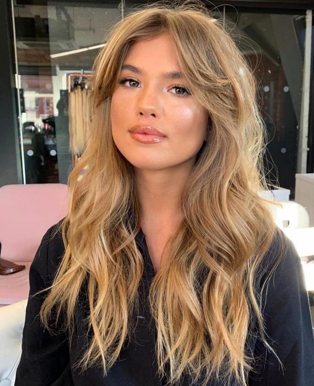 Mid-Back Layers With Wispy Bangs and Ash Blonde With Highlights Mid-Back Layers With Wispy Bangs and Ash Blonde With Highlights — Classy Bangs for Round Face