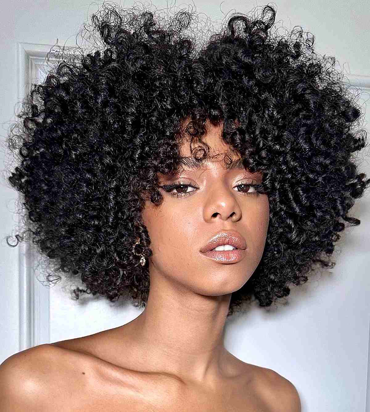 Voluminous Curly Afro With Short Bangs — Classy Black Curly Hair