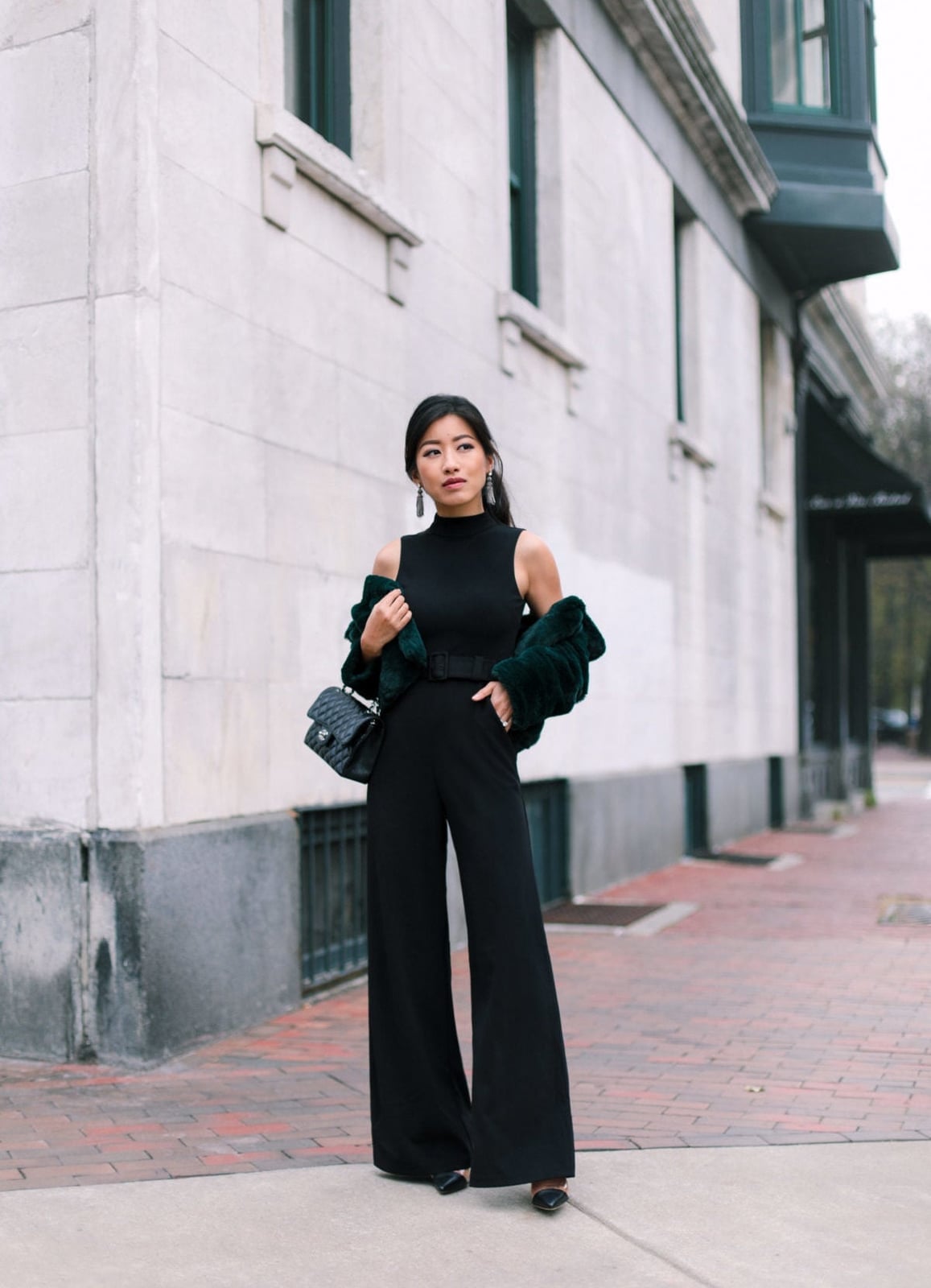 Sleeveless Jumpsuit Layered With Faux Fur Jacket — Classy Black Jumpsuit Outfit