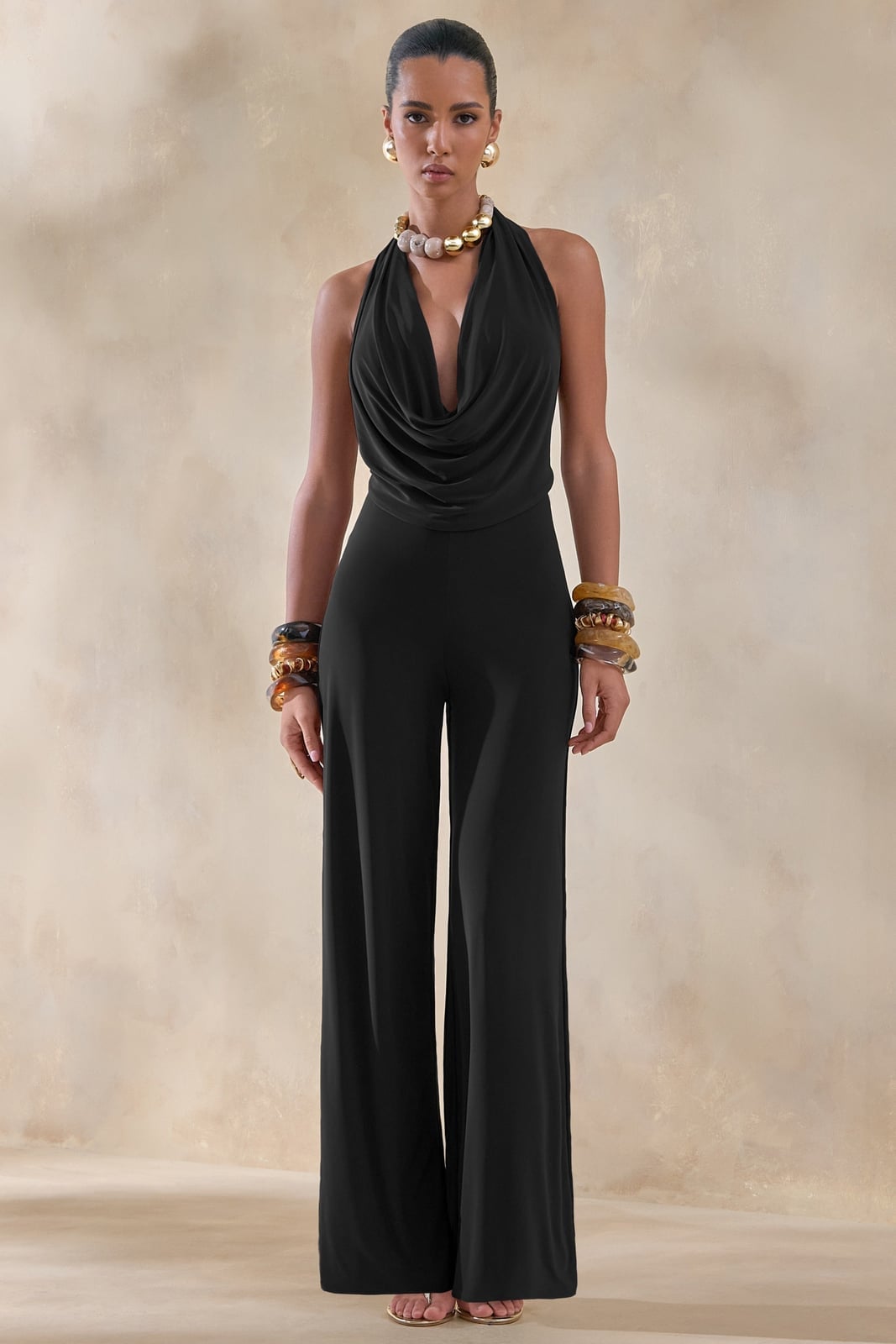 Halter Jumpsuit With Deep Plunge Neckline and Jersey Fabric — Classy Black Jumpsuit Outfit