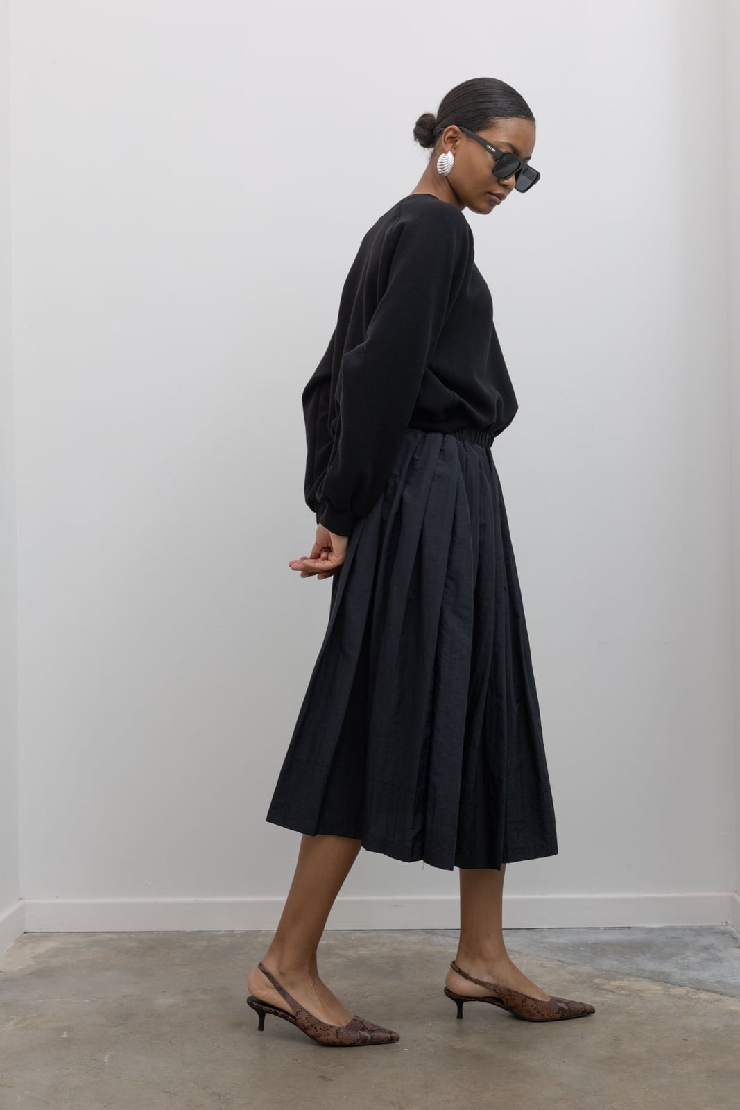 Nylon Black Midi Skirt With Crew Neck Sweatshirt — Classy Black Midi Skirt Outfit
