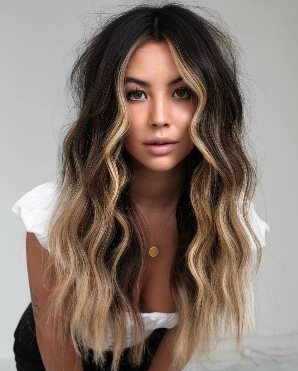 Mid-Back With Face-Framing Blonde Pieces — Classy Blonde Highlights on Dark Hair