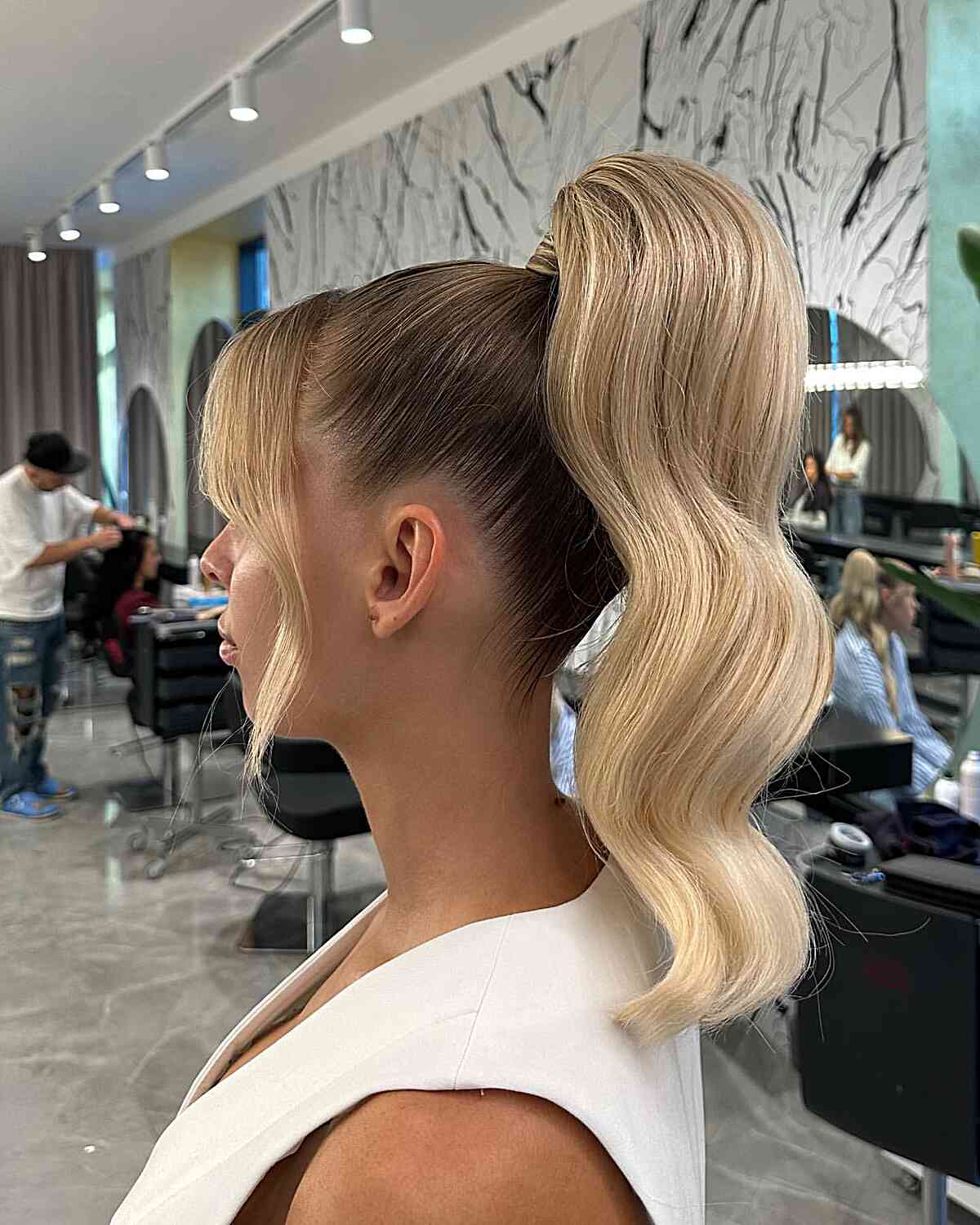 Ash Blonde Ponytail With Curtain Bangs And Voluminous Waves Ash Blonde Ponytail With Curtain Bangs And Voluminous Waves — Classy Blonde Ponytail