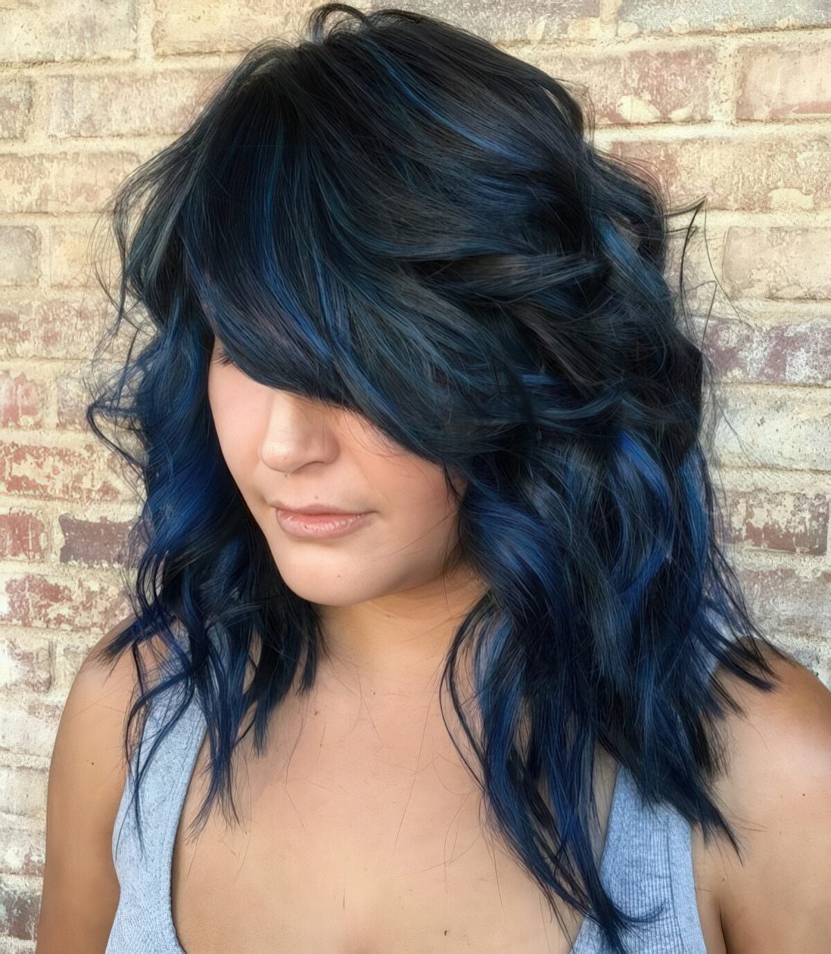 Collarbone Layers With Side Swept Bangs And Blue Streaks Collarbone Layers With Side Swept Bangs And Blue Streaks — Classy Blue Highlights