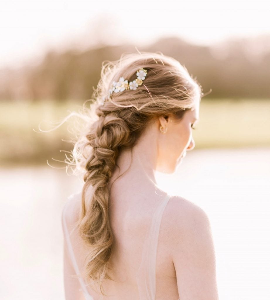 Side-Swept Braid Updo With Floral Accent — Classy Braided Styles