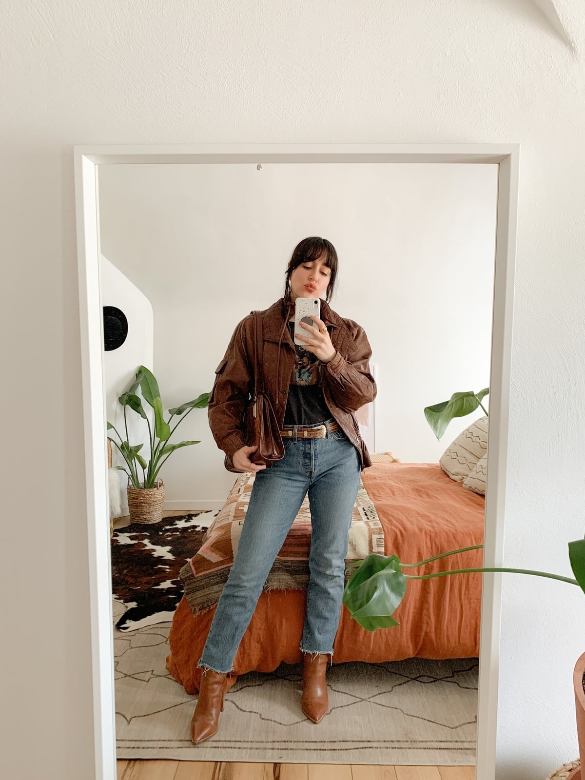 Brown Leather Jacket Graphic T Shirt Blue Jeans, Close-Up Take — Classy Brown Leather Jacket Outfit