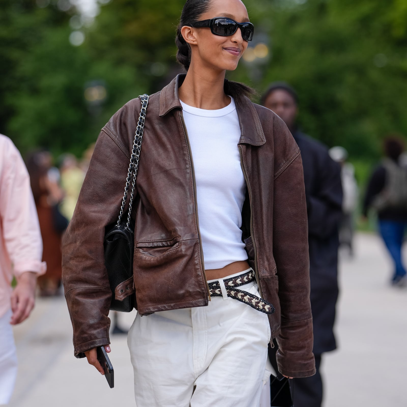Relaxed Brown Leather Jacket White T Shirt White Pants, Close-Up Take — Classy Brown Leather Jacket Outfit