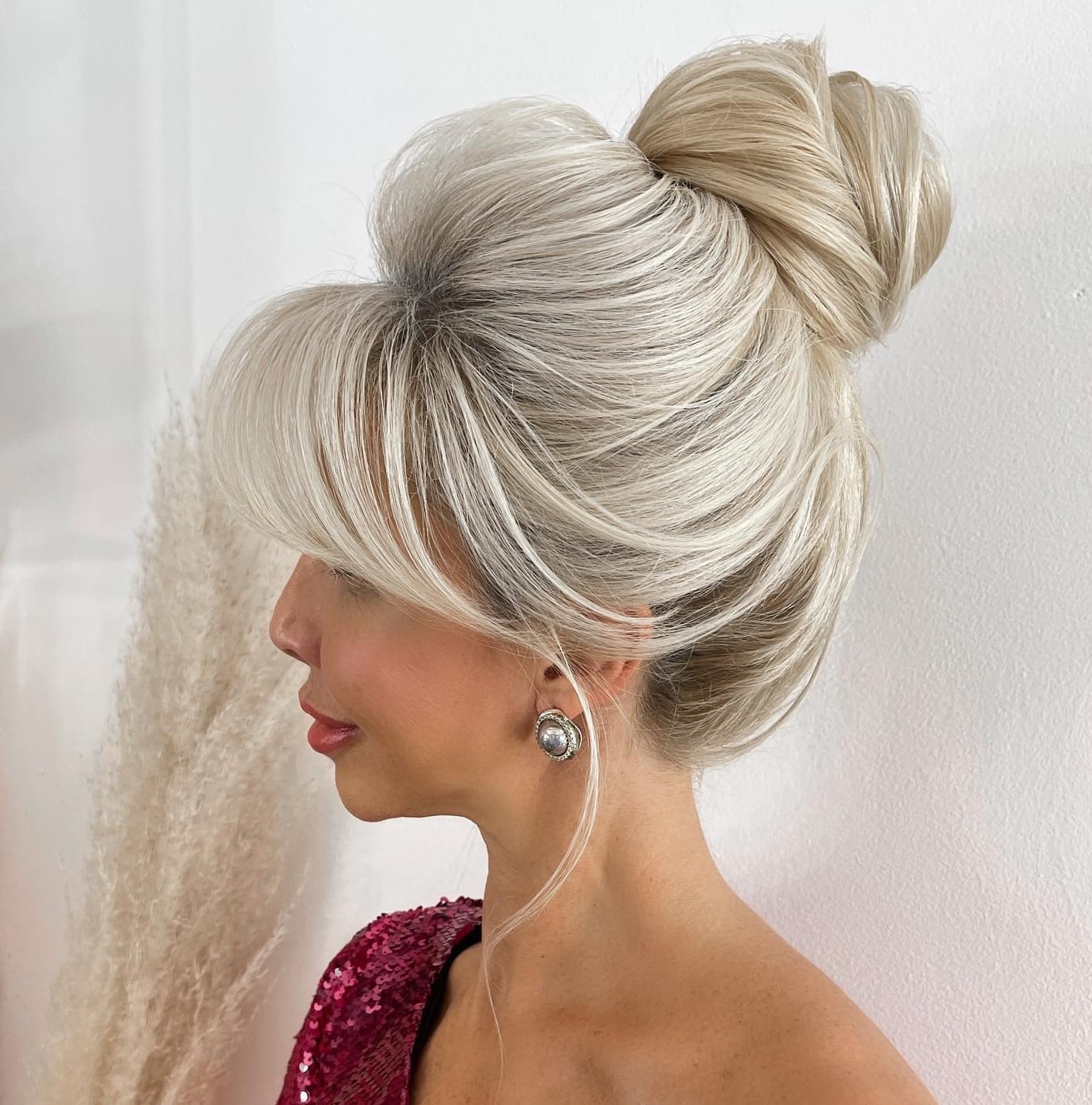Ash Blonde Voluminous Bun With Full Bangs Ash Blonde Voluminous Bun With Full Bangs — Classy Bun and Bang