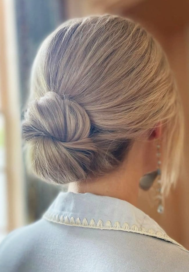 Beige Blonde Low Bun With Wispy Bangs Beige Blonde Low Bun With Wispy Bangs — Classy Bun and Bang