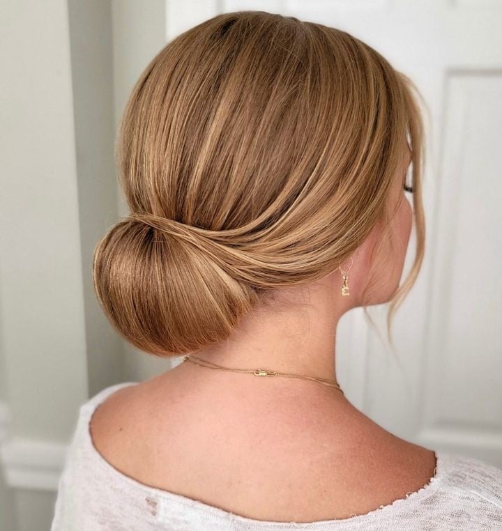 Honey Blonde Rolled Chignon With Curtain Bangs Honey Blonde Rolled Chignon With Curtain Bangs — Classy Bun and Bang
