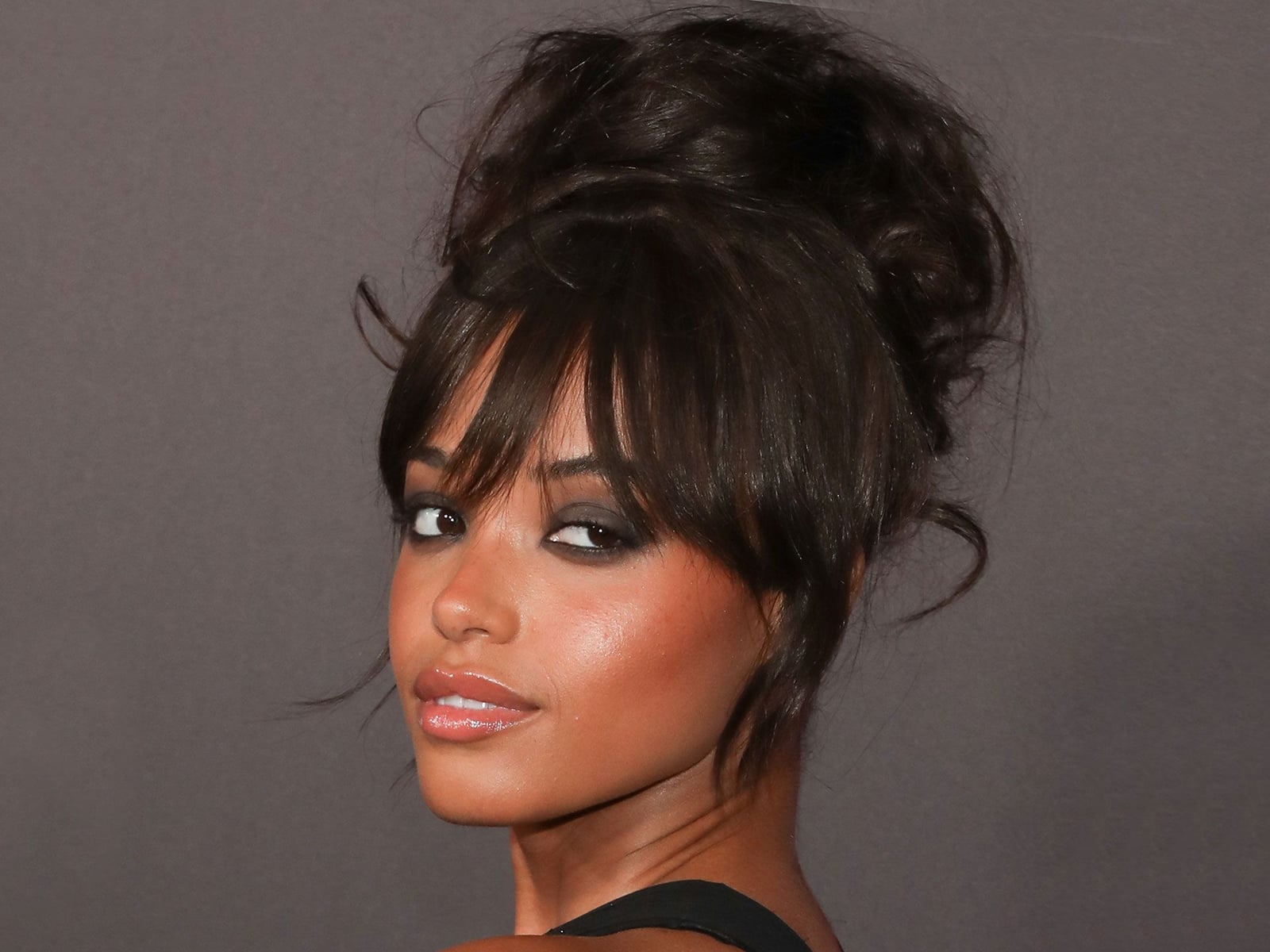 Voluminous Messy Bun With Curtain Bangs Voluminous Messy Bun With Curtain Bangs — Classy Bun and Bang