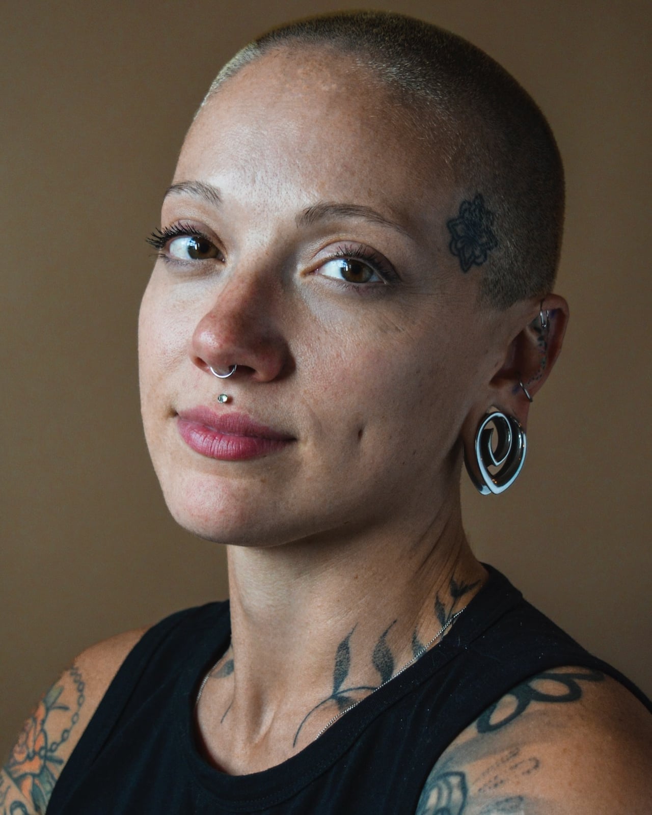 Shaved Head with Large Silver Spiral Earrings — Classy Buzz Cut