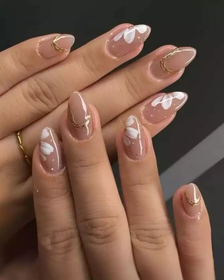 Nude Floral Gold Accent Almond Nails Nude Floral Gold Accent Almond Nails — Classy Concert Nails