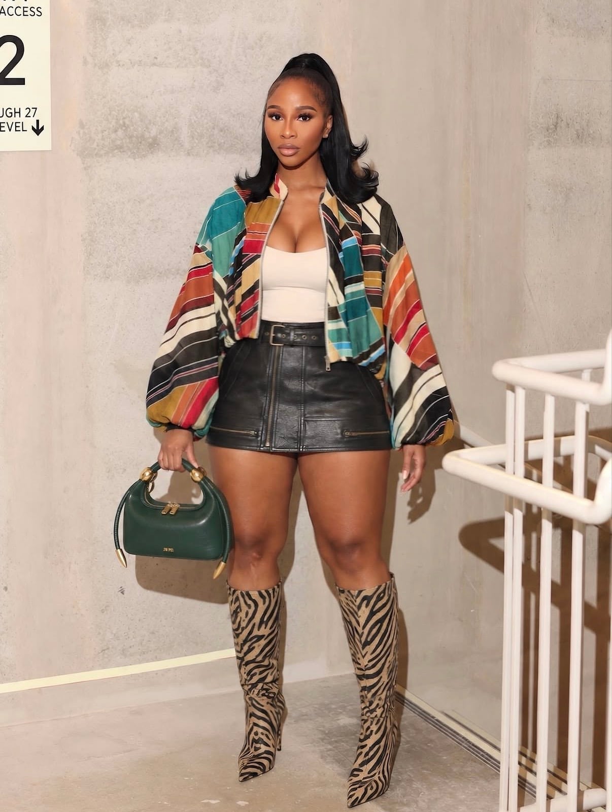 Striped Bomber Jacket with Zebra Print Boots — Classy Concert Outfits