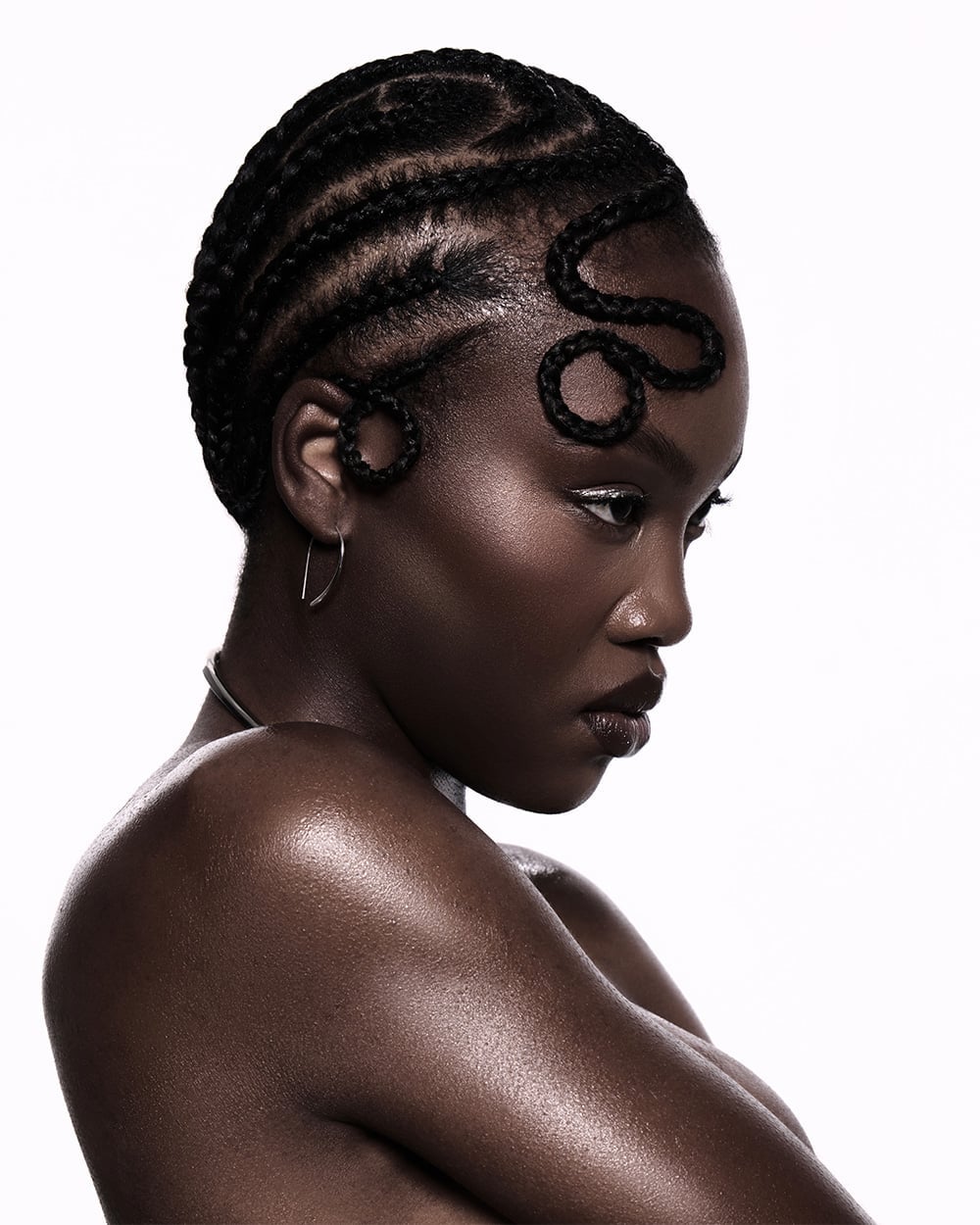 Black Cornrows With Intricate Swirl Patterns Black Cornrows With Intricate Swirl Patterns — Classy Cornrows Hairstyles