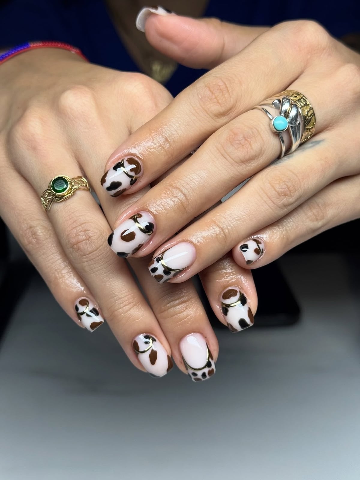 Short Almond Cow Print French Tips with Gold Accents — Classy Cow Print Nails