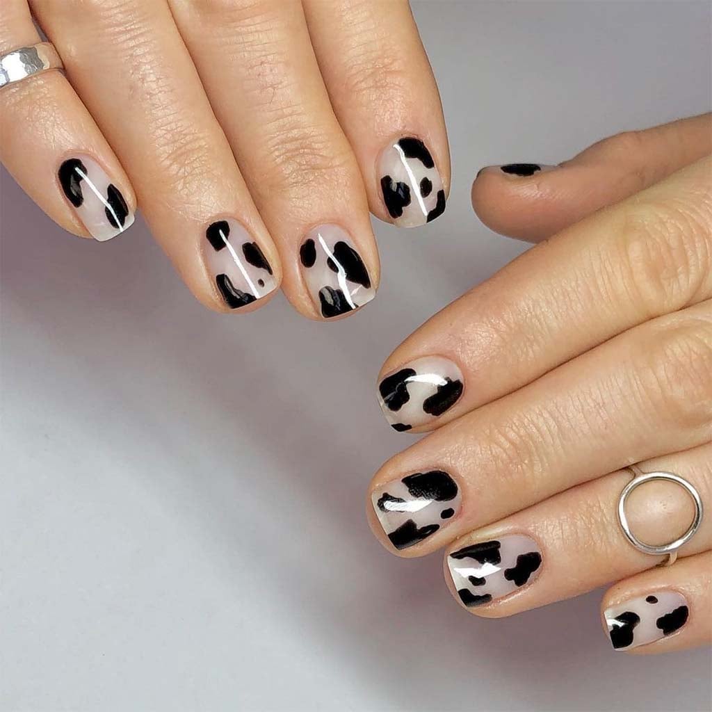 Black Spots on Sheer Nude Short Oval Nails — Classy Cow Print Nails
