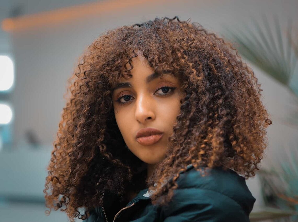 Shoulder Length Curls With Caramel Highlights — Classy Curly Hairstyles for Black Women