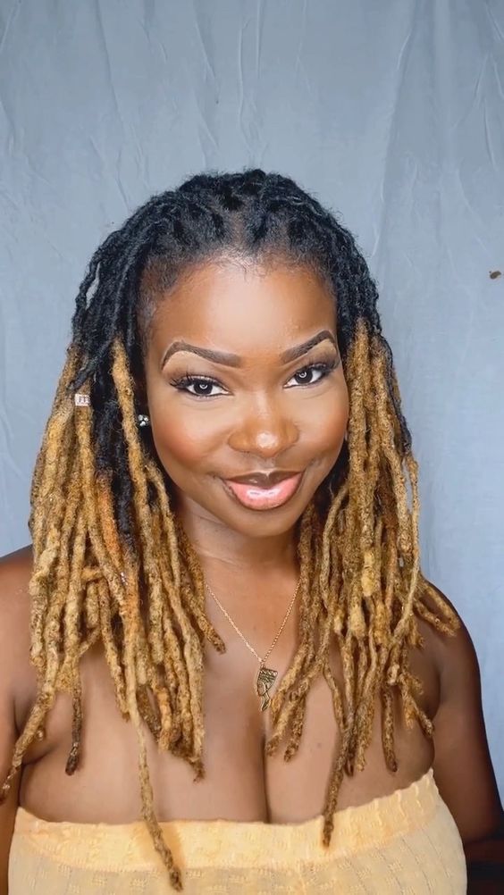 Mid-Back Locs With Striking Blonde Highlights Mid-Back Locs With Striking Blonde Highlights — Classy Down Locs