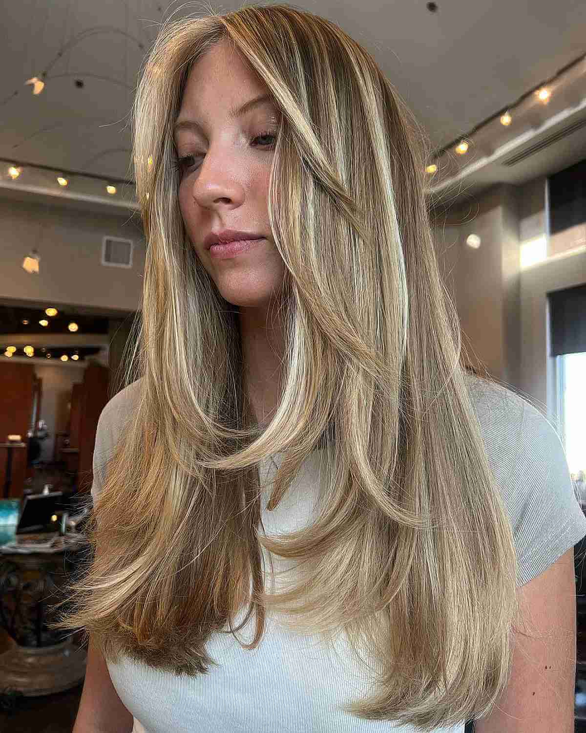 Mid-Back Blonde With Heavy Highlights Mid-Back Blonde With Heavy Highlights — Classy Face Framing Layers