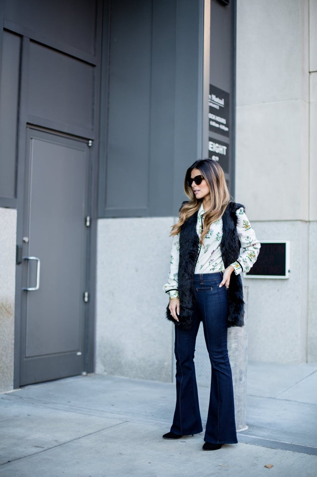 Faux Fur Vest Over Floral Blouse Faux Fur Vest Over Floral Blouse — Classy Flare Jeans Outfits
